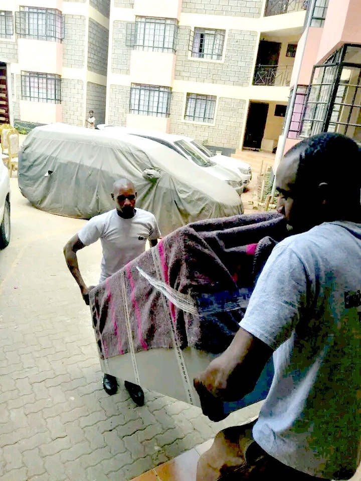 Team off-loading furniture at the new residence