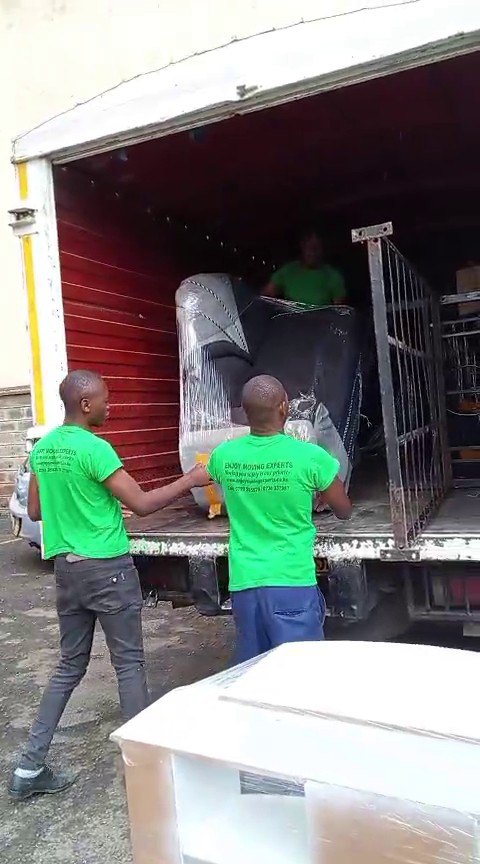 Moving truck being loaded on a Nairobi street